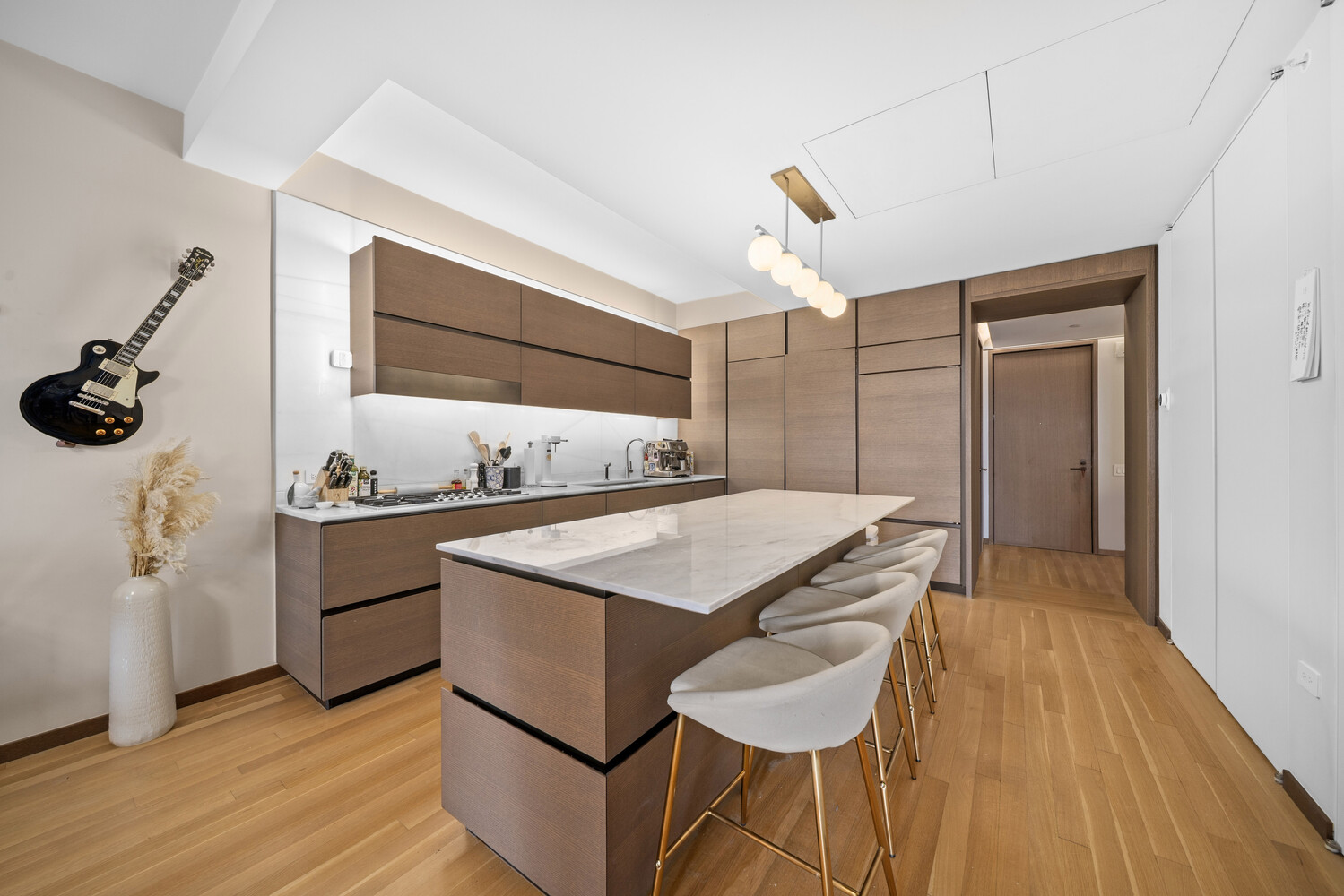 551 West 21st Street, Unit 4B Manhattan, NY 10011 - Photo 3 of 20 a kitchen with a sink appliances and cabinets