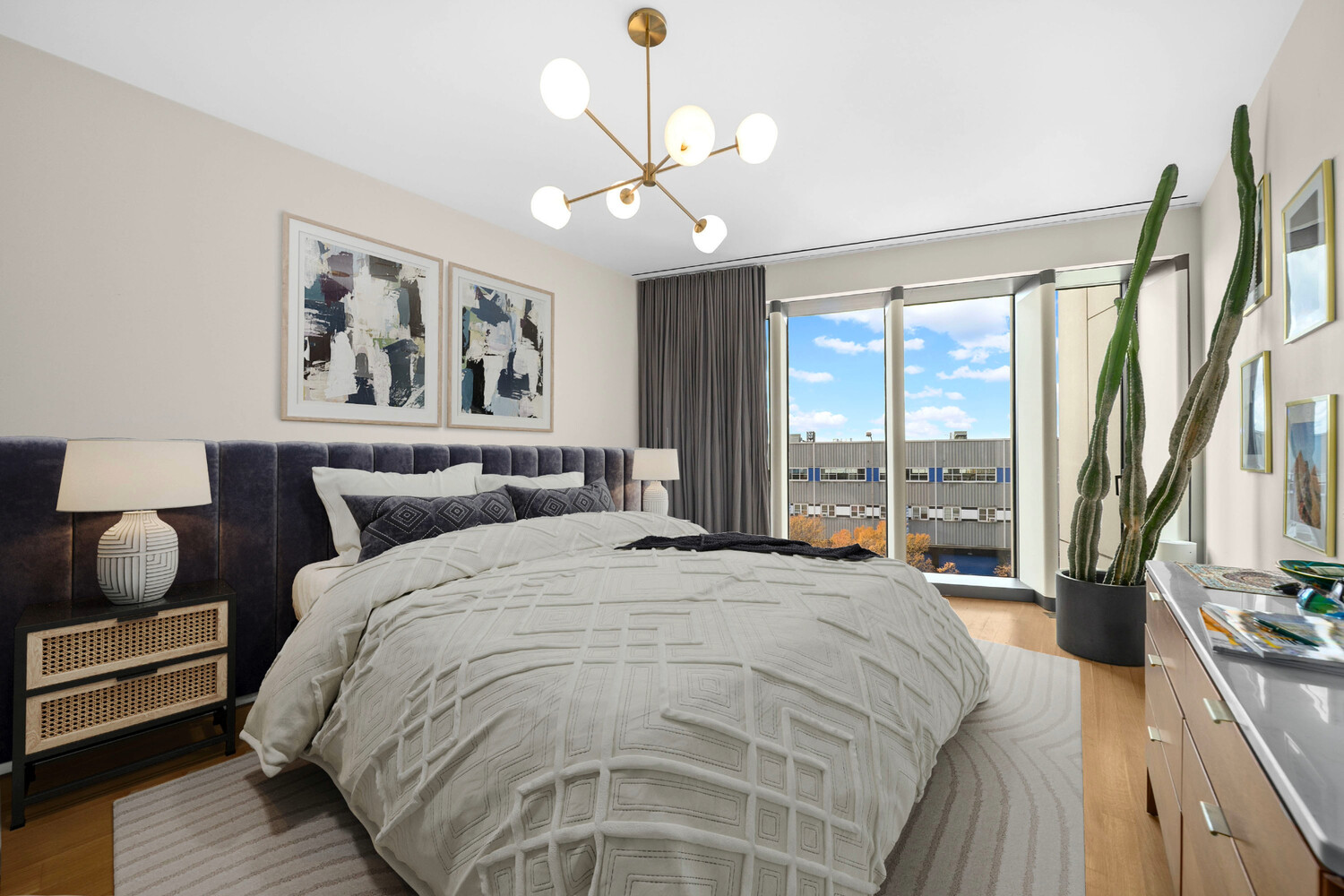 551 West 21st Street, Unit 4B Manhattan, NY 10011 - Photo 4 of 20 a spacious bedroom with a bed and a large window