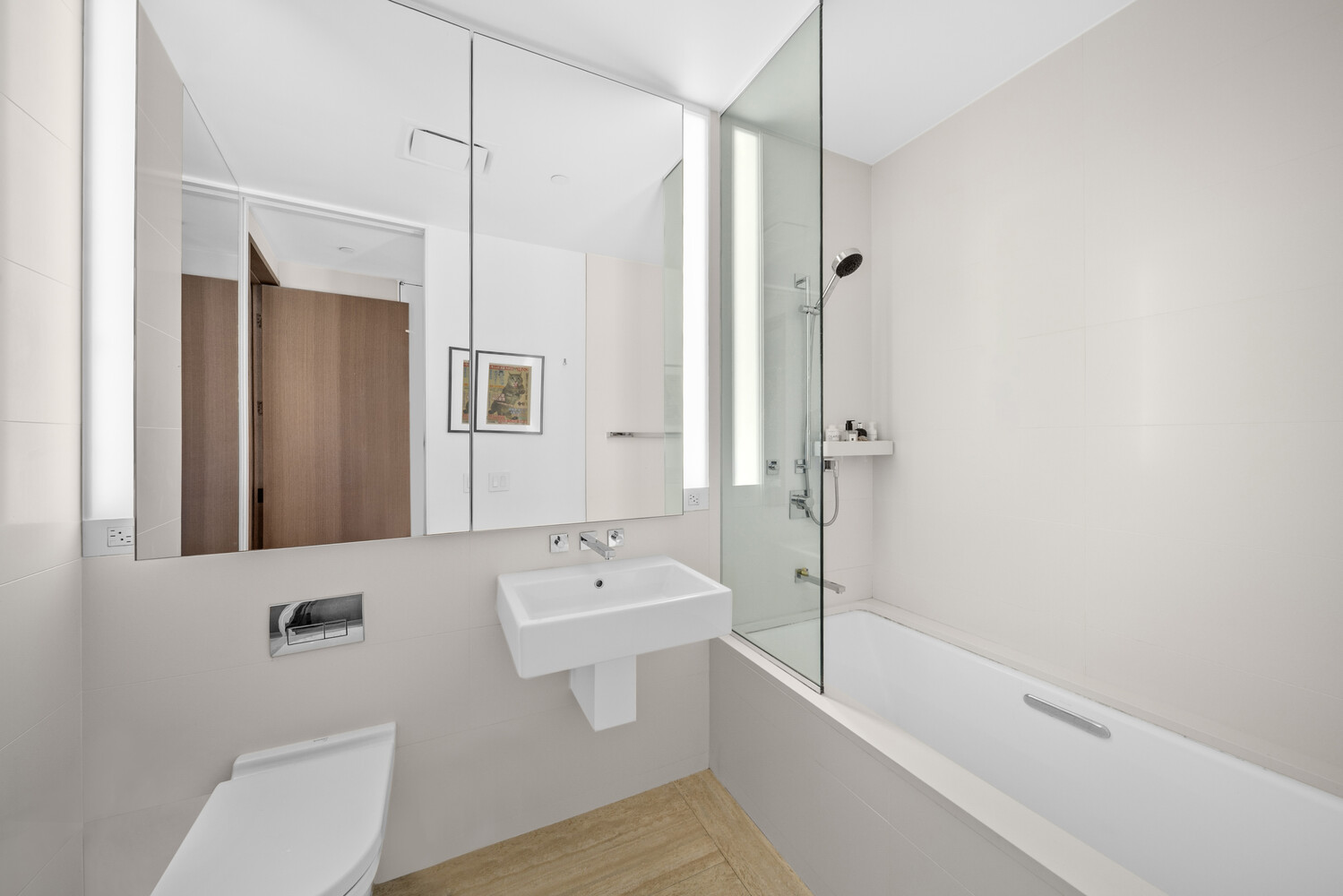 551 West 21st Street, Unit 4B Manhattan, NY 10011 - Photo 5 of 20 a bathroom with a sink a toilet and shower