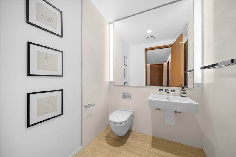 551 West 21st Street, Unit 4B Manhattan, NY 10011 - Photo 8 of 20 a bathroom with a toilet sink and mirror