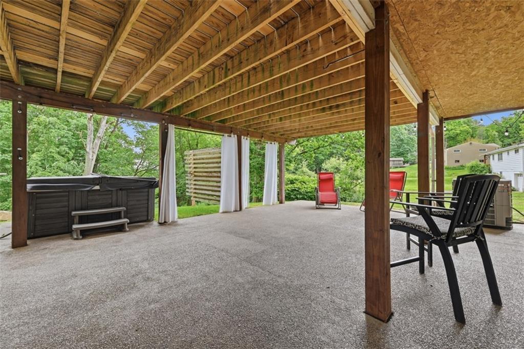 5380 Hardt Road Gibsonia, PA 15044 - Photo 37 of 49 A second patio space is underneath the deck. The hot tub will convey with the property.