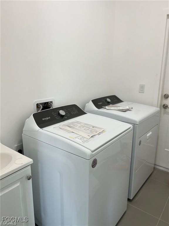 744 Clancy Street East Lehigh Acres, FL 33974 - Photo 12 of 14 a utility room with dryer and washer