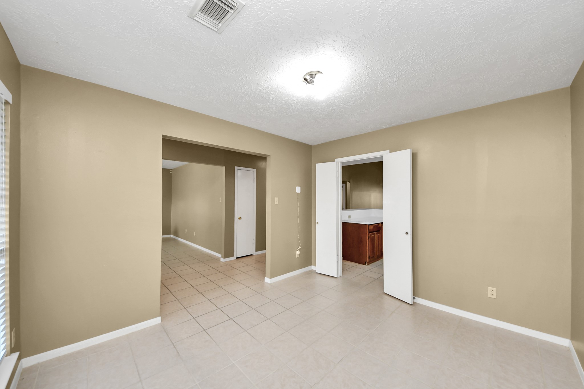 3310 Keygate Drive Spring, TX 77388 - Photo 17 of 45 an empty room with an entrance to other room