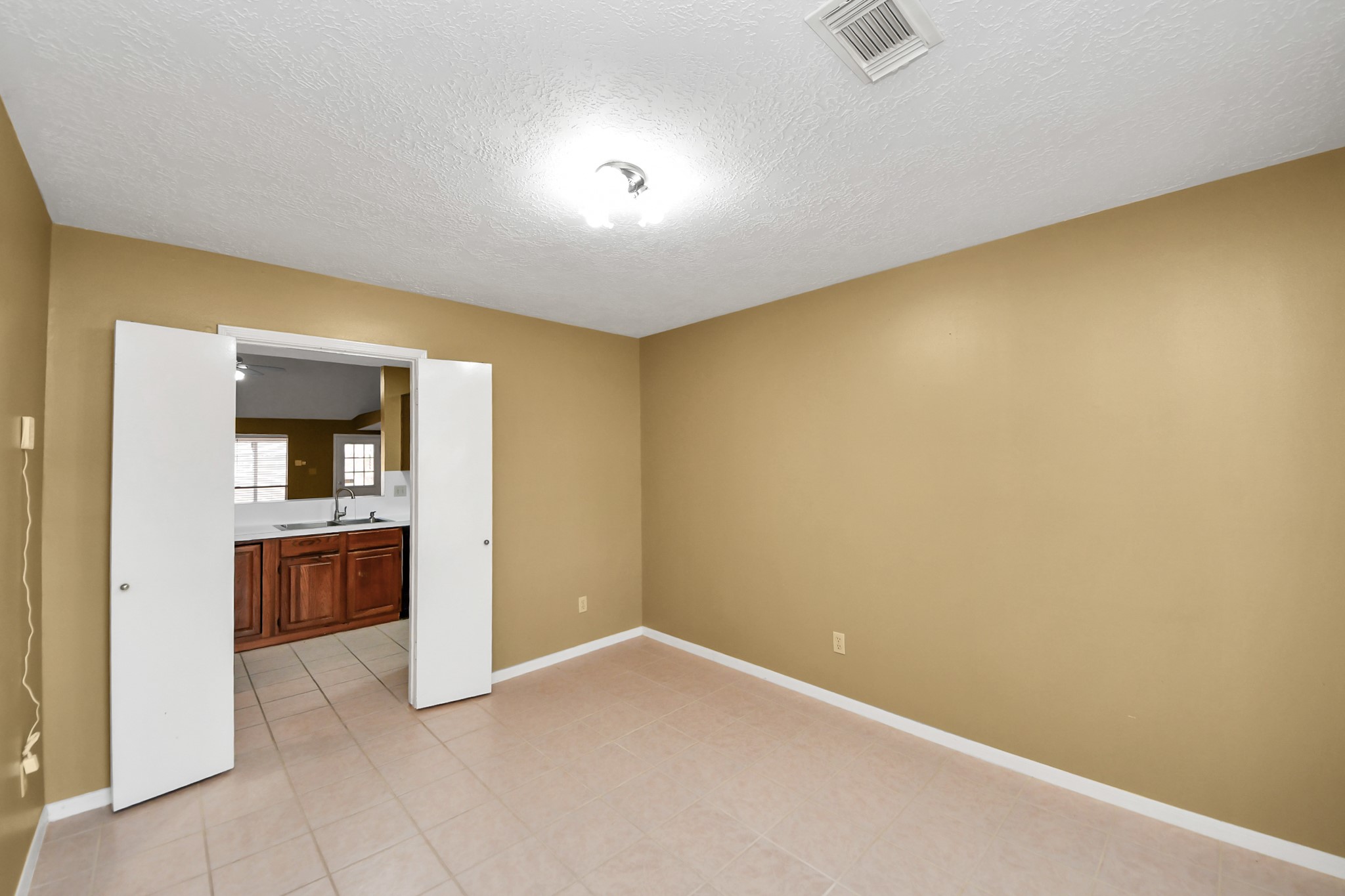 3310 Keygate Drive Spring, TX 77388 - Photo 18 of 45 an empty room with a kitchen