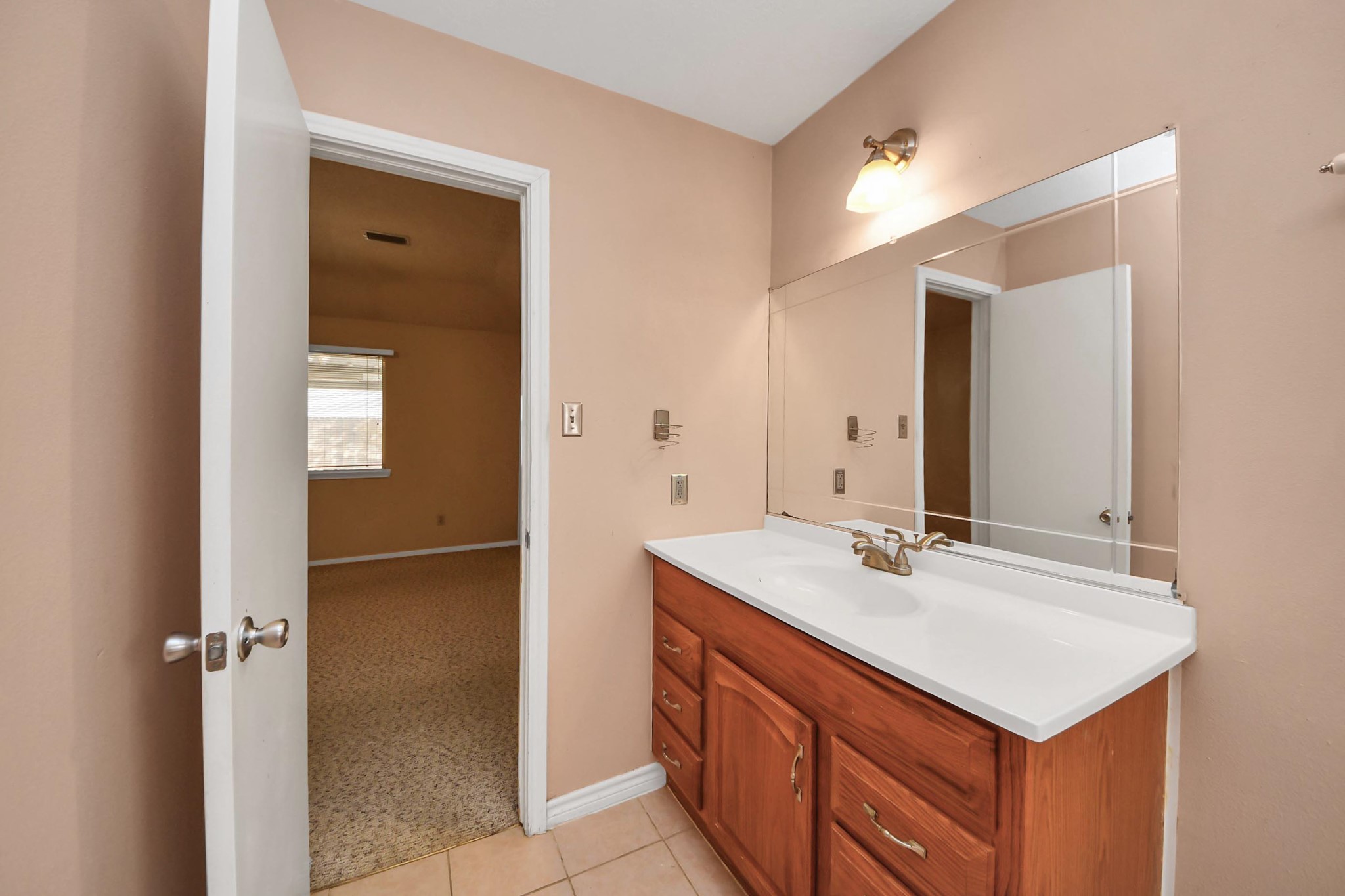 3310 Keygate Drive Spring, TX 77388 - Photo 27 of 45 a bathroom with a sink and a mirror