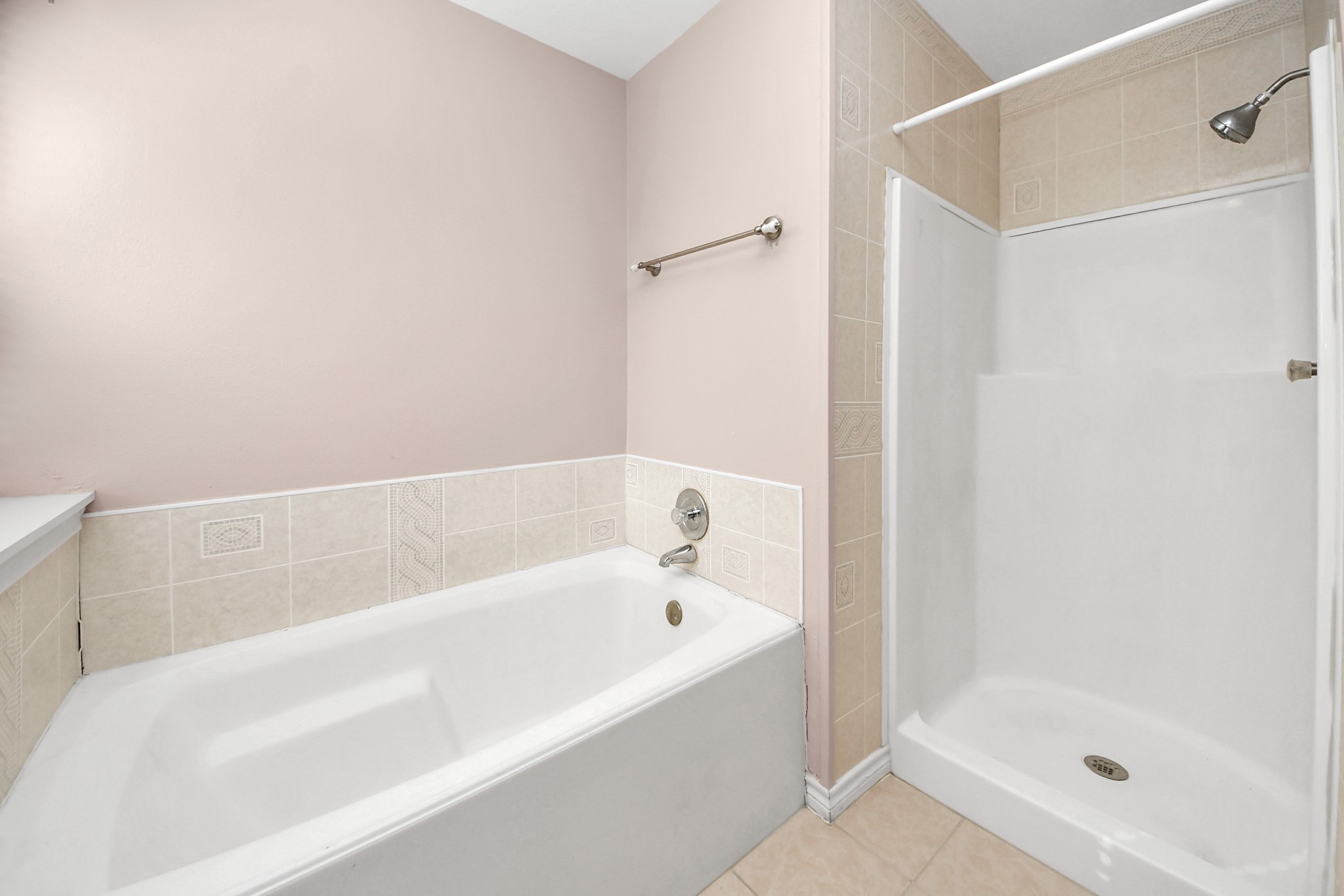 3310 Keygate Drive Spring, TX 77388 - Photo 29 of 45 a bathroom with a bathtub and a shower