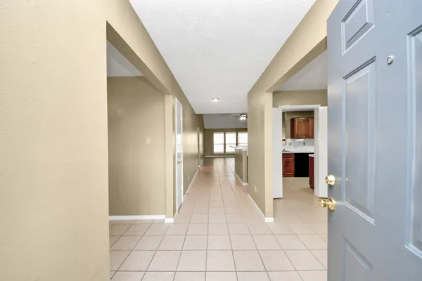 a view of a hallway view with wooden floor and staircase