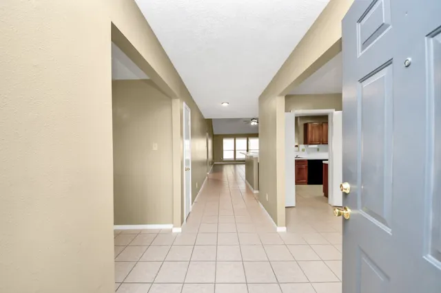 a view of a hallway view with wooden floor and staircase