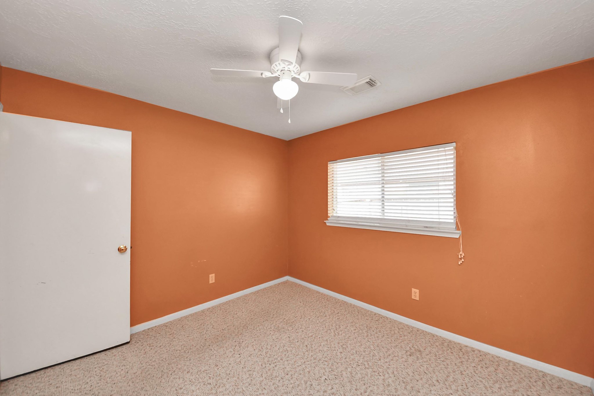 3310 Keygate Drive Spring, TX 77388 - Photo 37 of 45 an empty room with a window and a chandelier fan