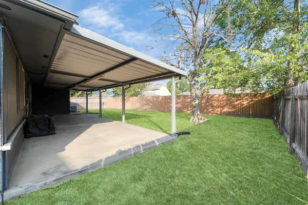 a view of backyard with green space