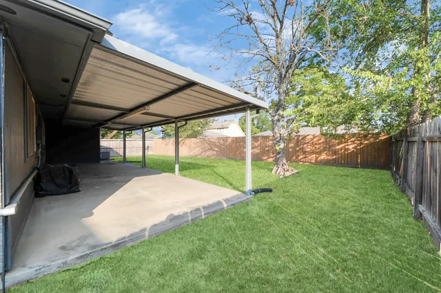 a view of backyard with green space