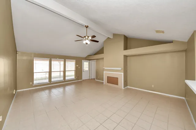 a view of an empty room with windows