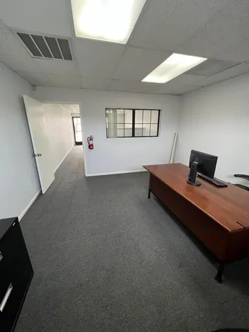 a bedroom with bed and window