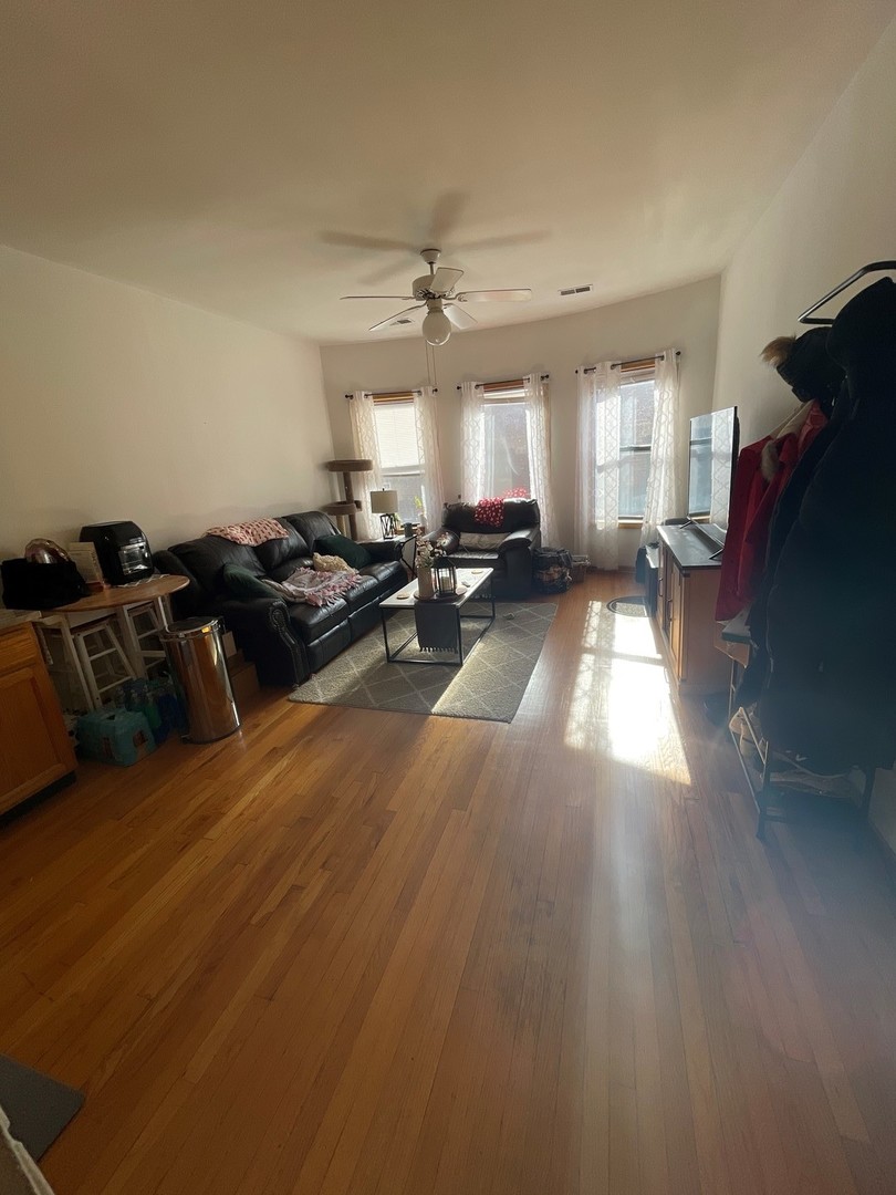 628 West Patterson Avenue, Unit 3S Chicago, IL 60613 - Photo 3 of 10 a living room with furniture and a fireplace