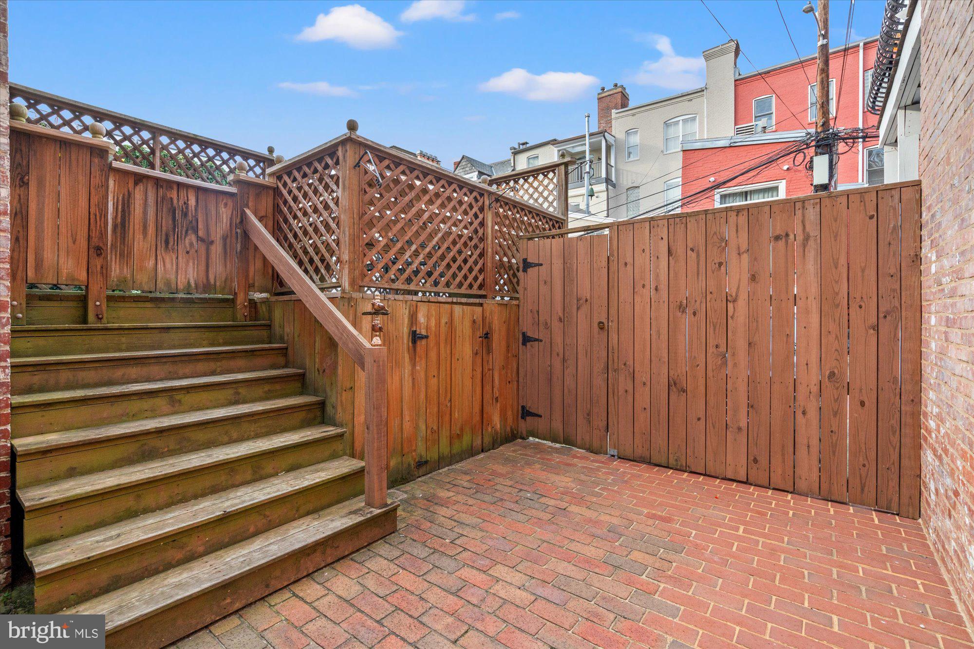 2021 Q Street Northwest Washington, DC 20009 - Photo 21 of 57 Shared brick patio leading to off street parking