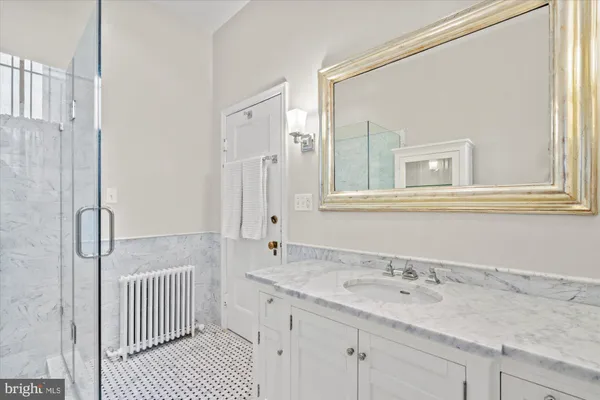 a living room with furniture a rug and a fireplace