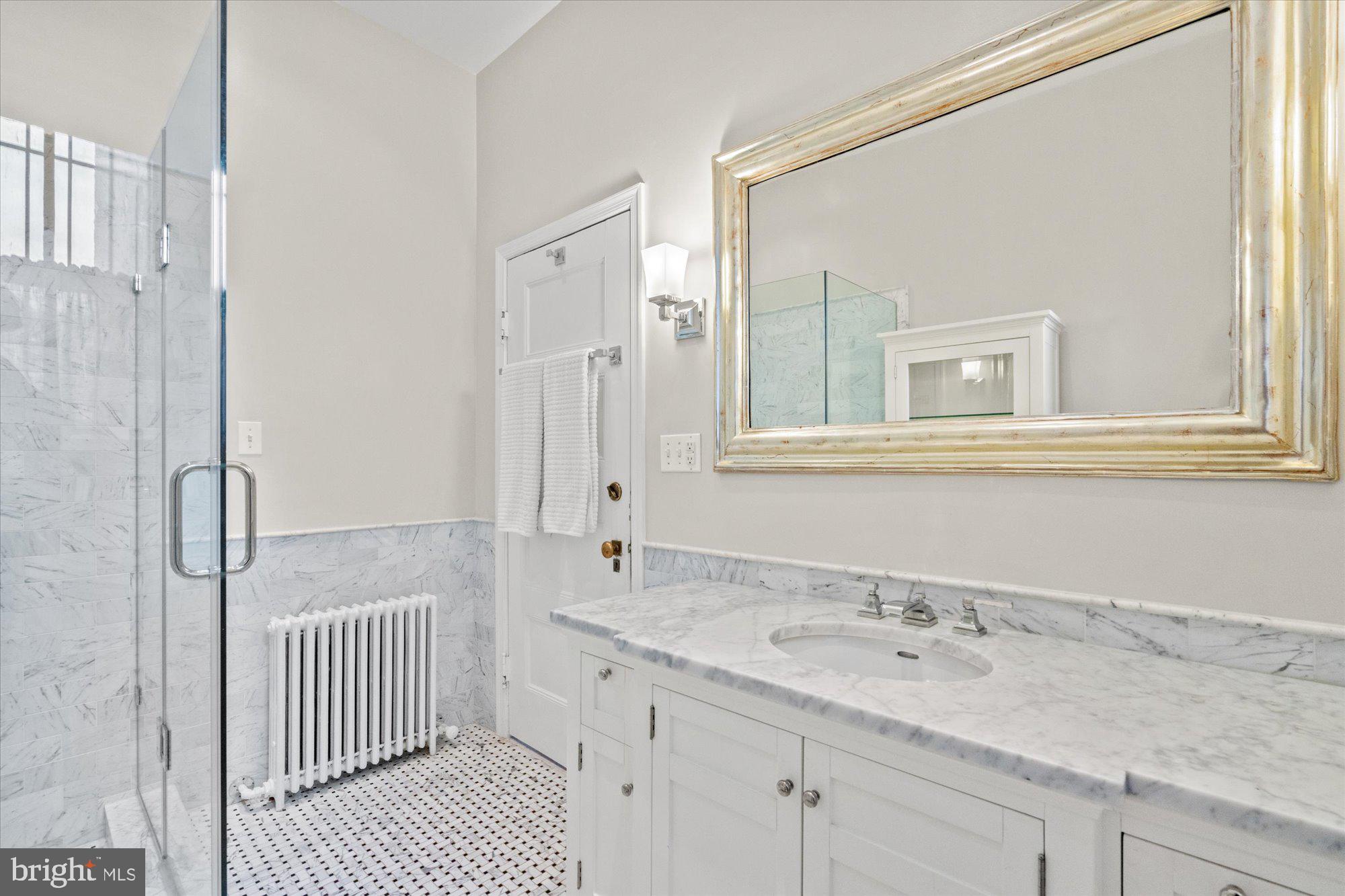 2021 Q Street Northwest Washington, DC 20009 - Photo 27 of 57 Completely renovated full hall bathroom