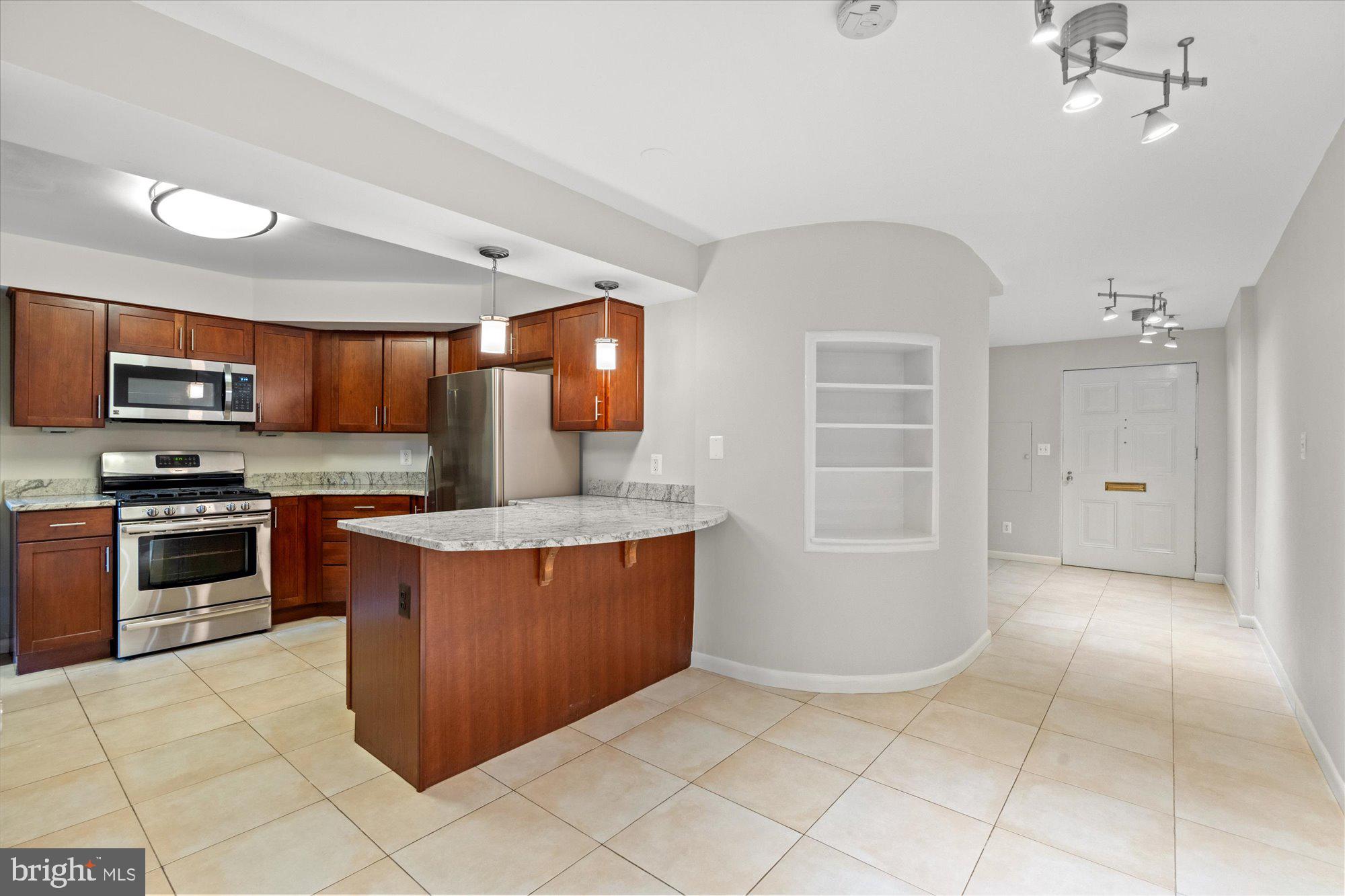 2021 Q Street Northwest Washington, DC 20009 - Photo 46 of 57 Lower level renovated kitchen with dining area