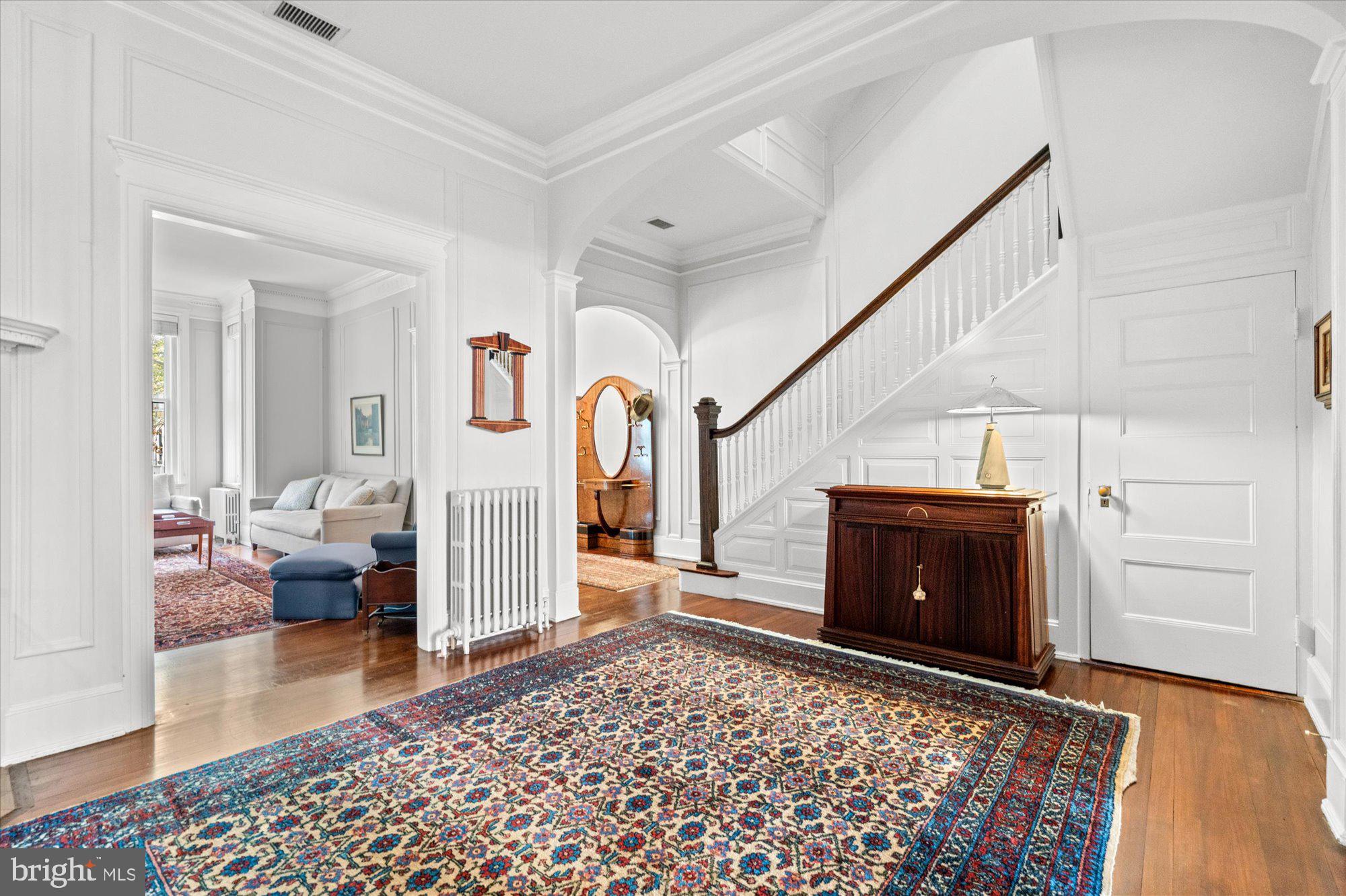 2021 Q Street Northwest Washington, DC 20009 - Photo 5 of 57 The main level reception room with half bathroom