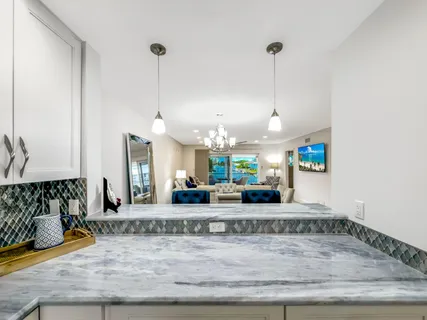 a view of a living room and kitchen
