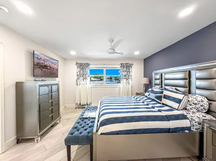 a bedroom with a bed and a table