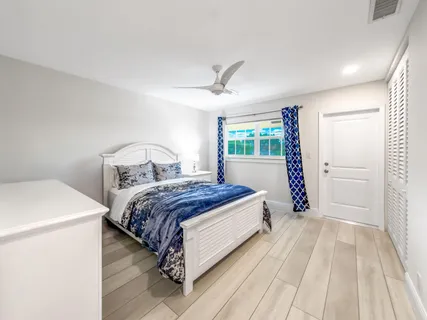 a bedroom with a bed and a table