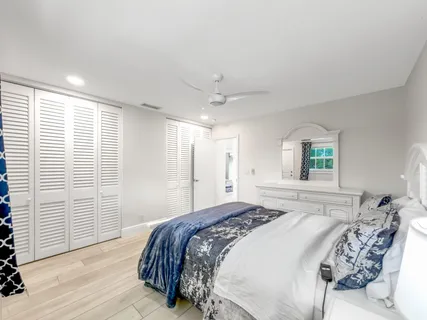 a bedroom with a large bed and a window