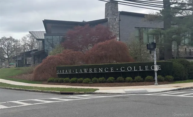 a blue chair sitting in a room next to a blue chair