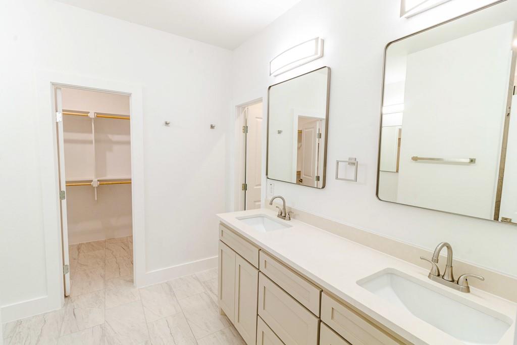 536 Highview Court Godley, TX 76044 - Photo 11 of 27 a bathroom with a sink and a mirror