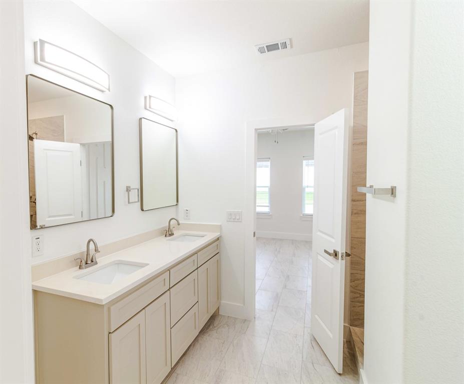 536 Highview Court Godley, TX 76044 - Photo 13 of 27 a bathroom with a sink and a mirror