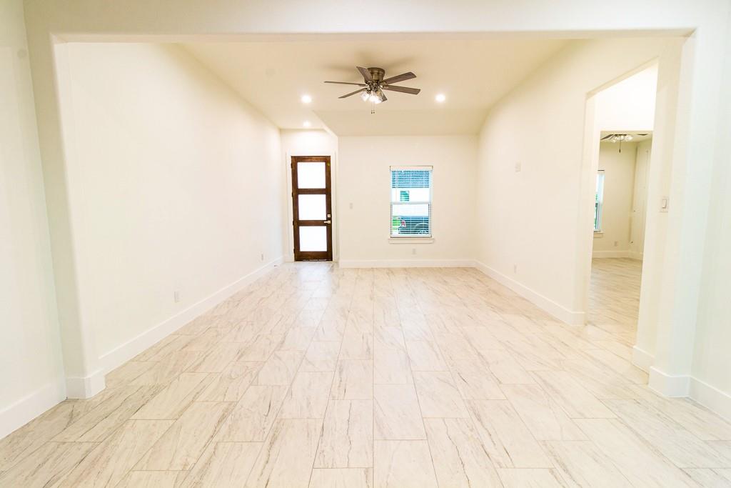 536 Highview Court Godley, TX 76044 - Photo 3 of 27 a view of an empty room with a window