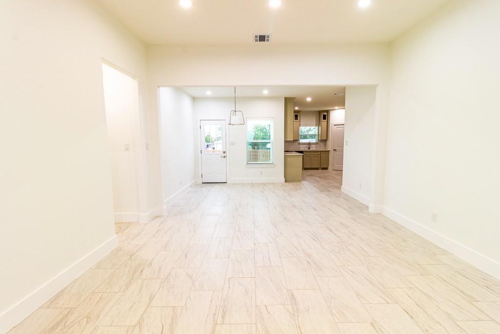 536 Highview Court Godley, TX 76044 - Photo 6 of 27 a view of a big room with wooden floor and a window