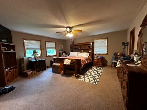 10716 County Line Road Greenville, PA 16125 - Photo 21 of 43 a bedroom with furniture and a flat screen tv