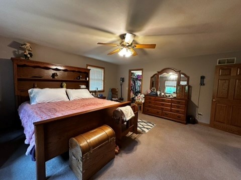 10716 County Line Road Greenville, PA 16125 - Photo 23 of 43 a bed room with a bed and a chandelier