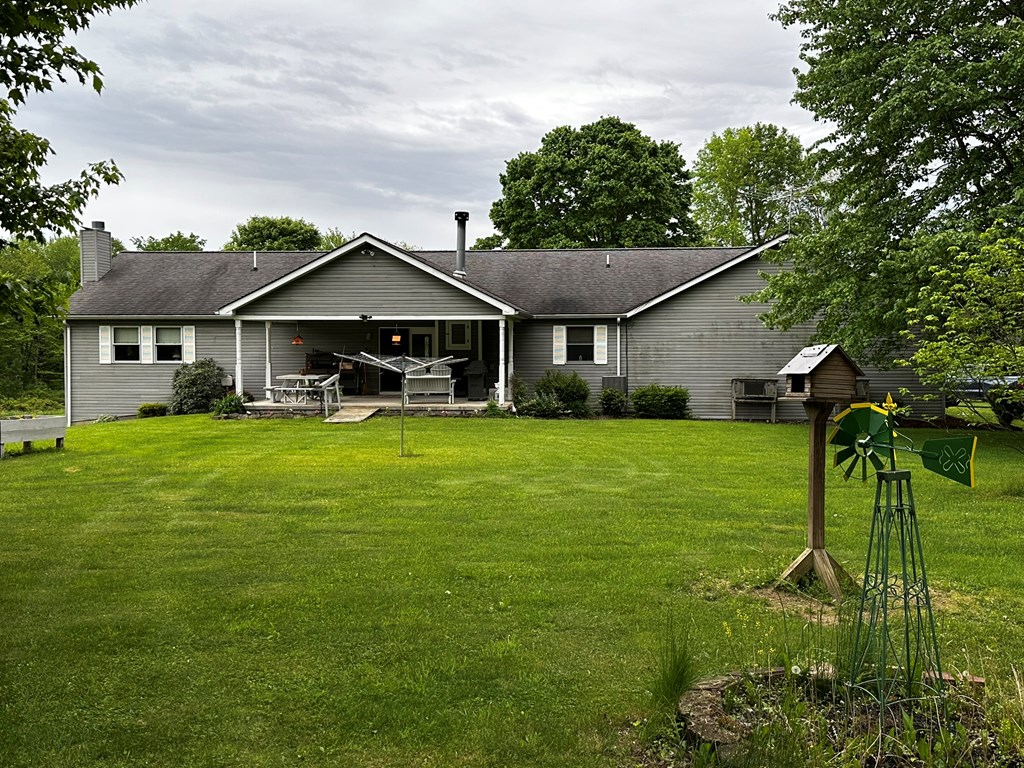 10716 County Line Road Greenville, PA 16125 - Photo 3 of 43 a front view of a house with garden