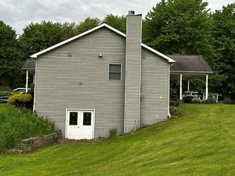 10716 County Line Road Greenville, PA 16125 - Photo 4 of 43 a view of a backyard with plants and large tree