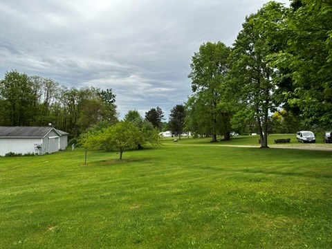 10716 County Line Road Greenville, PA 16125 - Photo 6 of 43 a garden with trees in the background