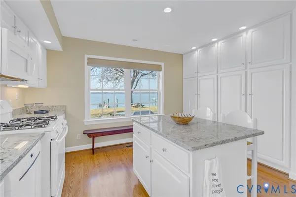 a kitchen that has a sink and a stove in it