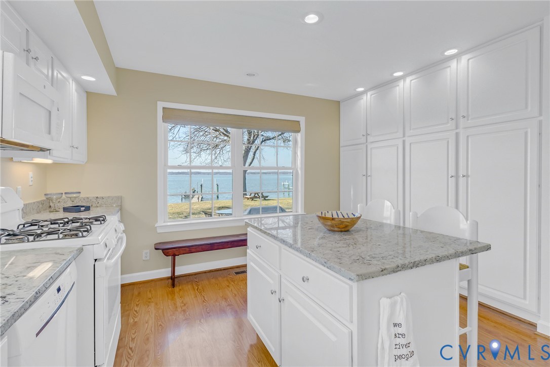 1159 Riverdale Road Warsaw, VA 22572 - Photo 12 of 42 a kitchen that has a sink and a stove in it
