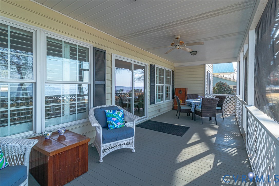 1159 Riverdale Road Warsaw, VA 22572 - Photo 18 of 42 a outdoor space with patio the couches and a dining table with balcony view