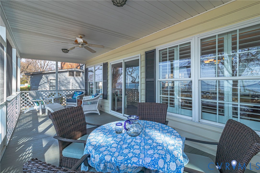 1159 Riverdale Road Warsaw, VA 22572 - Photo 19 of 42 a living room with furniture large windows and wooden floor