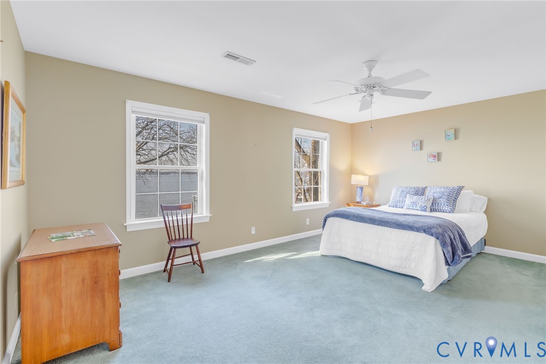 1159 Riverdale Road Warsaw, VA 22572 - Photo 22 of 42 a spacious bedroom with a bed and a window