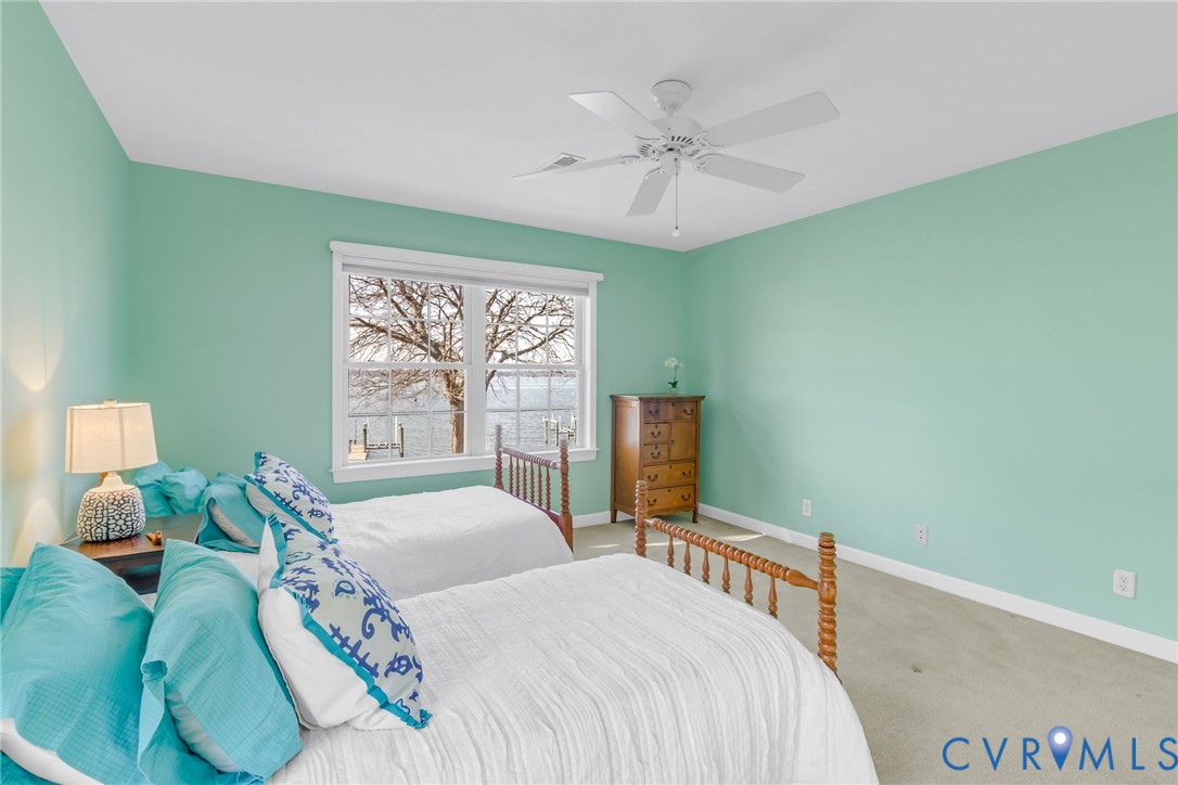 1159 Riverdale Road Warsaw, VA 22572 - Photo 28 of 42 a bedroom with a bed and a window