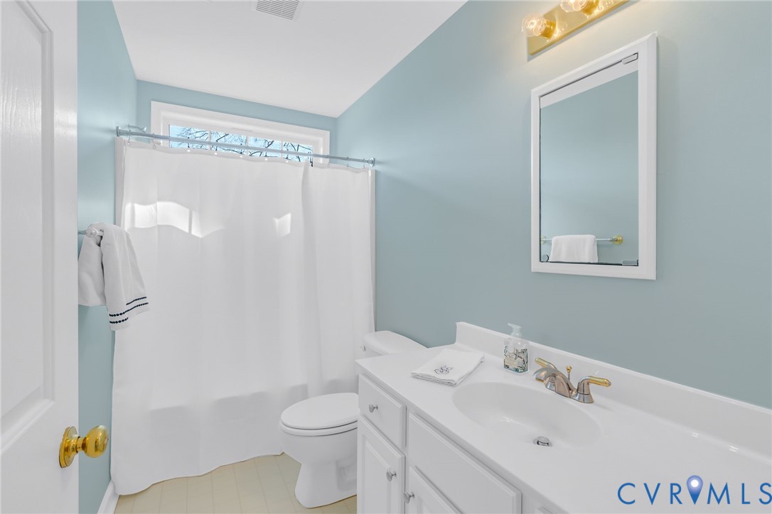 1159 Riverdale Road Warsaw, VA 22572 - Photo 29 of 42 a bathroom with a sink toilet and shower