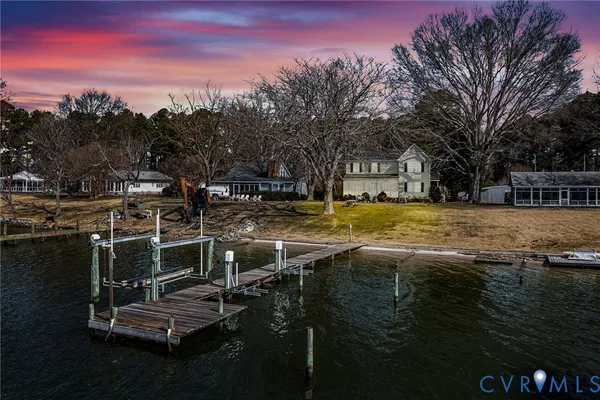 a view of a lake with a house in the background