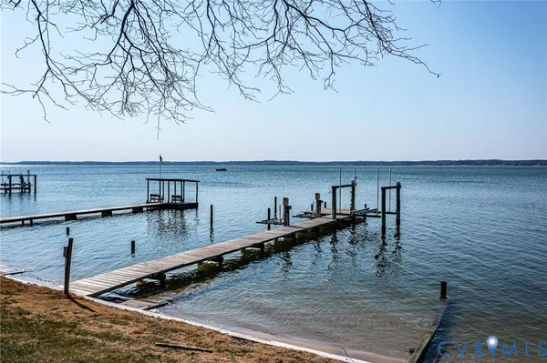 a view of a kitchen with kitchen island a sink and wooden floor