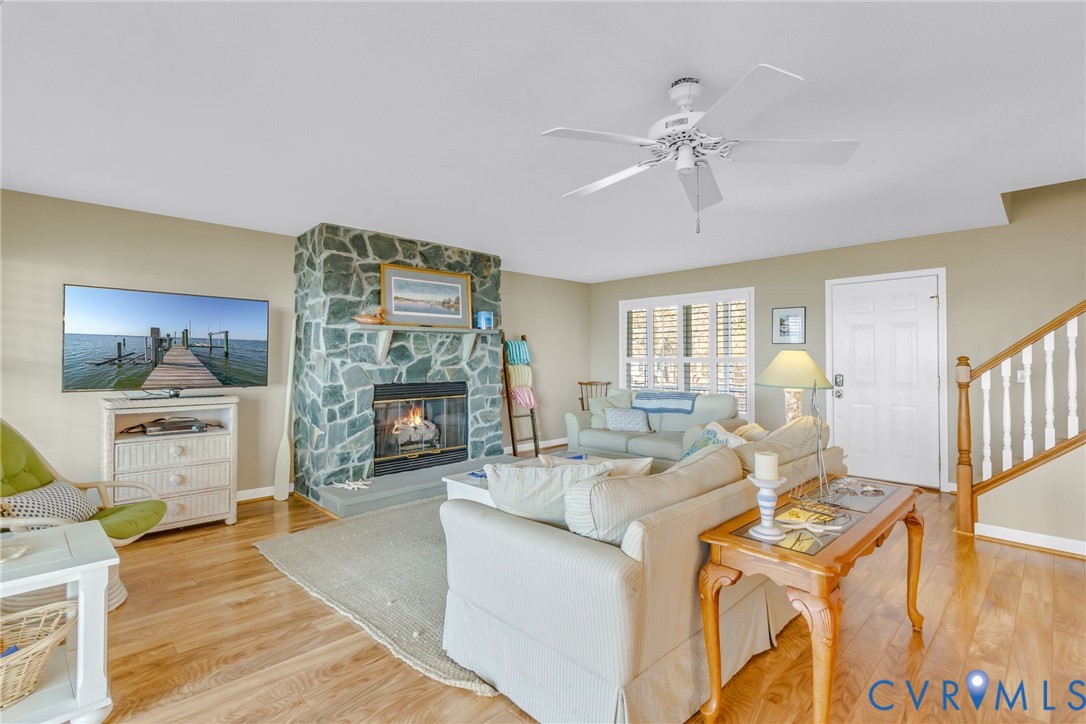 1159 Riverdale Road Warsaw, VA 22572 - Photo 6 of 42 a living room with furniture and a fireplace