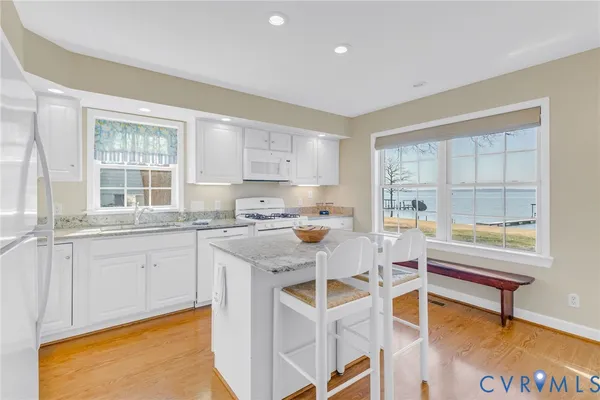 a kitchen with a sink cabinets and window
