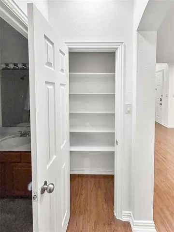 a view of a room with a wooden floor