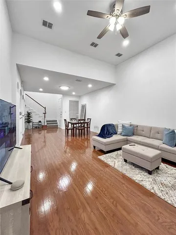 a lobby with furniture and a chandelier